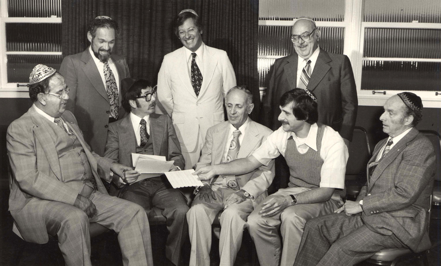 photo - Group of men with documents, State of Israel Bonds, Vancouver, B.C., 1970. 